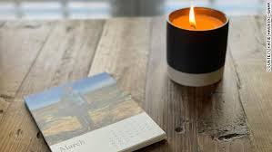 a burning candle and a journal for self reflection